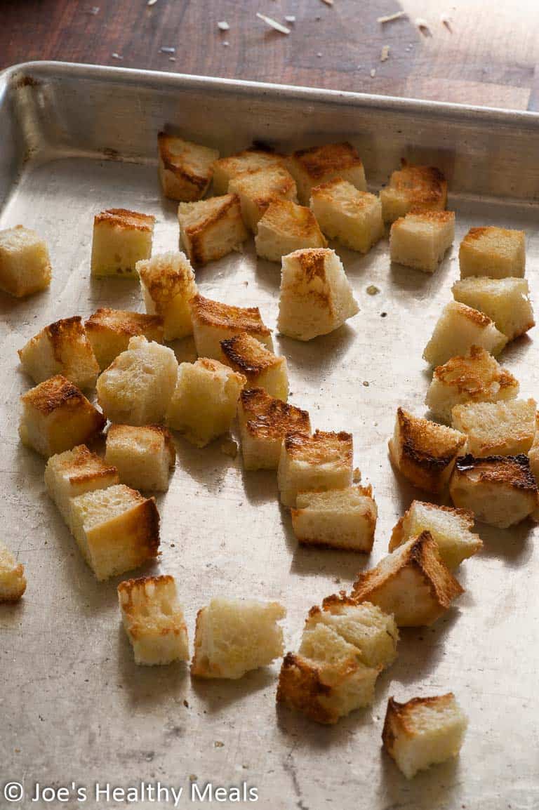 Sheet pan with toasted bread cubes.