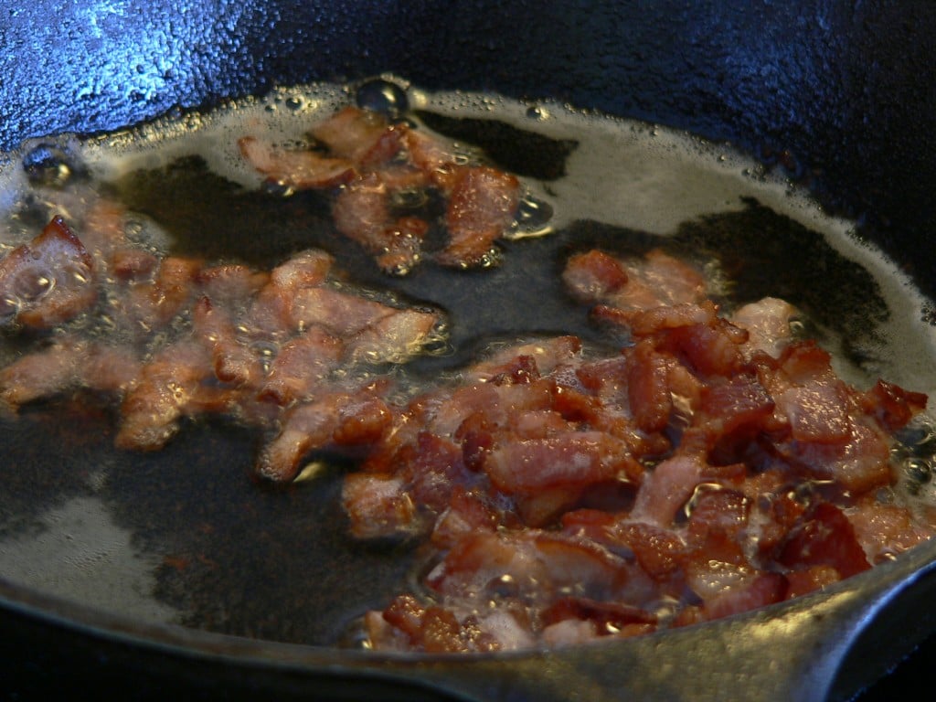 Crispy bacon in a skillet.