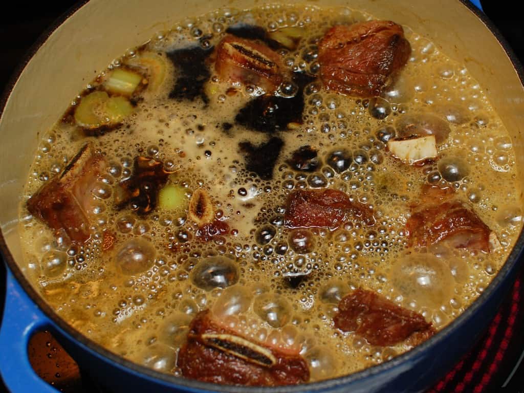 Braised beef short ribs with beef broth and guiness beer added to the dutch oven.