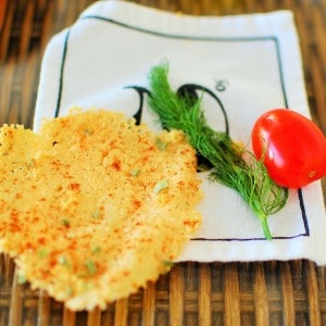 A cheese crisp on a fabric napkin.