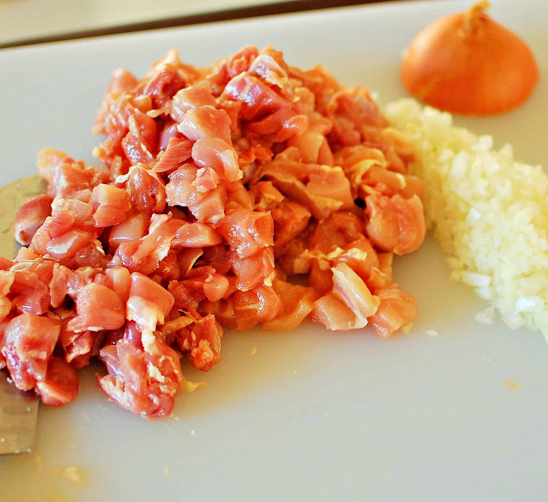 Diced chicken thighs and onion.