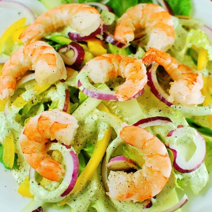 Overhead view of a plate of Green Goddess Salad and shrimp.