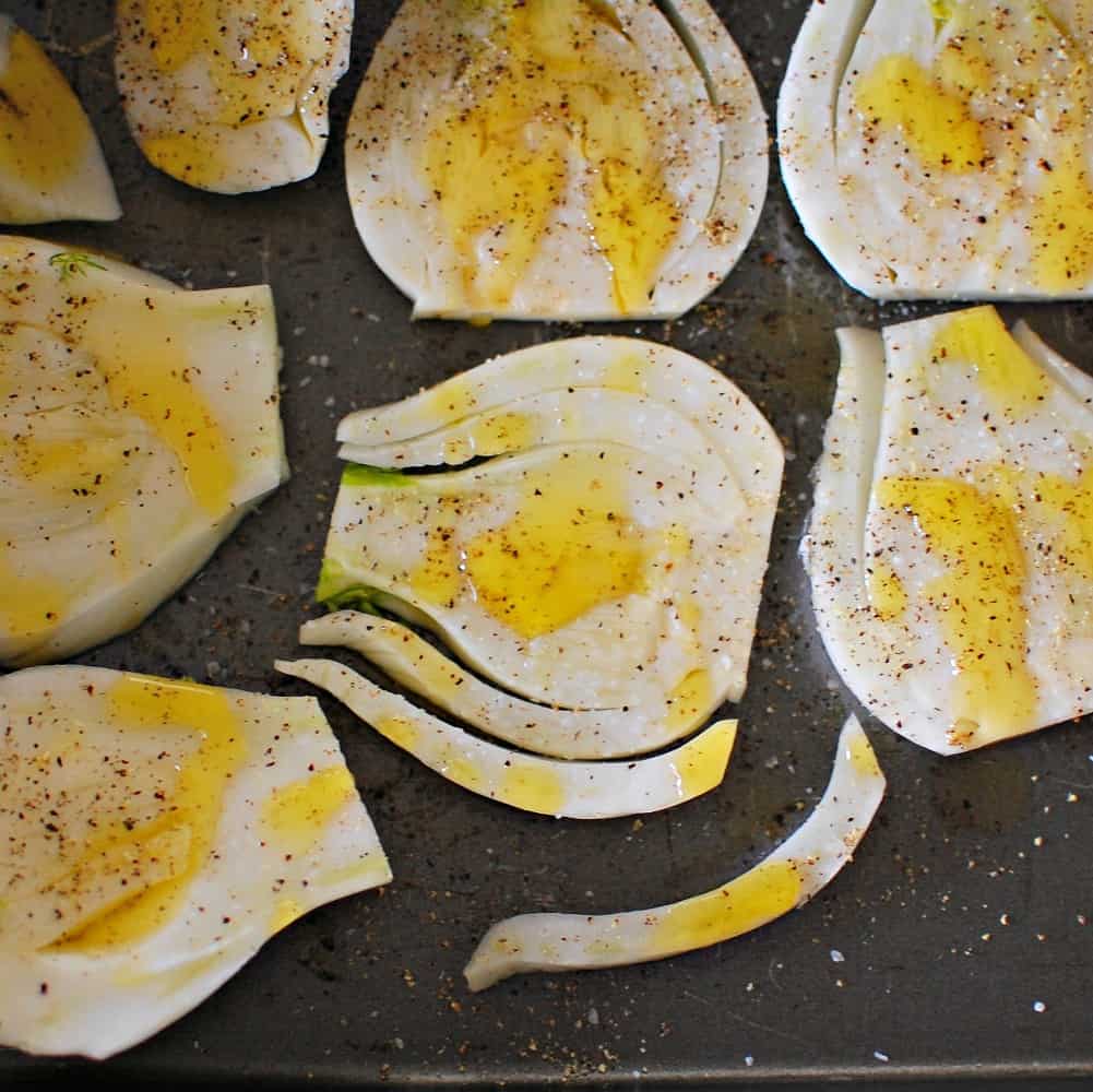 Sliced fennel with olive oil and seasoning.