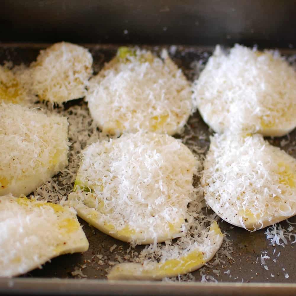 Sliced fennel covered with grated parmesan.