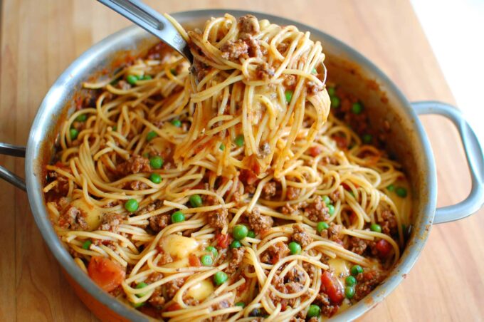 Spaghetti hot dish in a skillet.