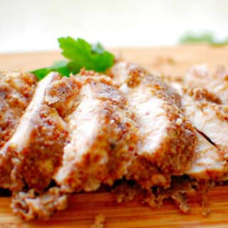 Sliced chicken breast on a cutting board.