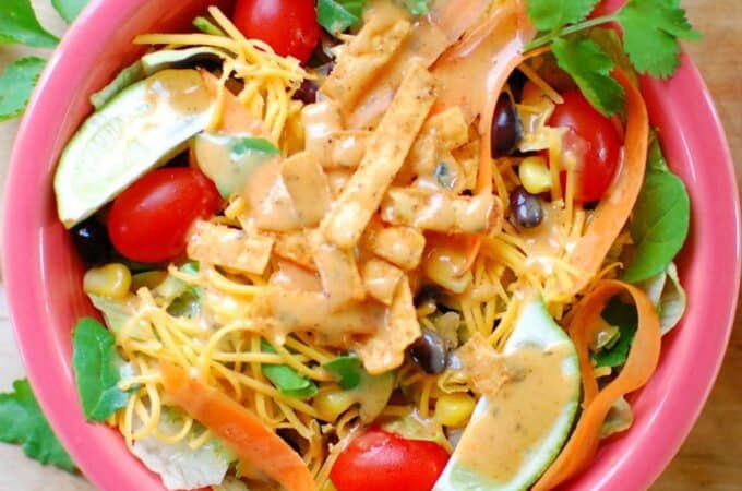 Salad with tortilla strips and dressing.