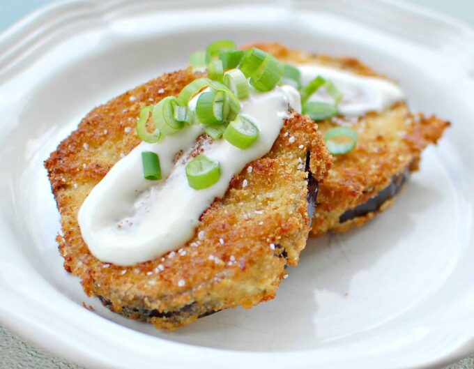 Plate with fried eggplant and cream sauce.