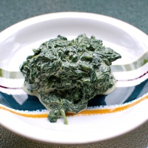 Creamy cardamom wilted spinach on a plate.