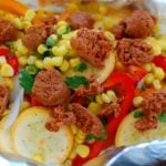 Grilled chorizo and vegetables in foil pack.