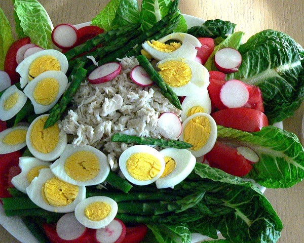 Crab meat salad with boiled eggs, and asparagus.