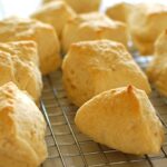 Beer biscuits from scratch on a cooling rack.