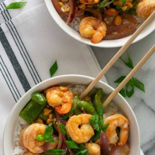 Overhead view of 2 bowls of shrimp stir fry.