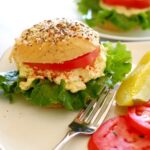 rye sandwich rolls with egg salad and tomatoes