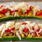 2 zucchini boats ready for the oven.