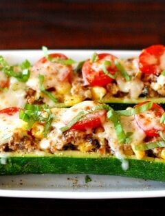 Italian sausage stuffed zucchini boats. YUM! | joeshealthymeals.com