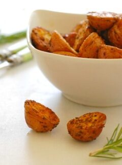 Roasted potato appetizer with chive sauce. Baby red potatoes beautifully roasted with rosemary and garlic creates an easy before meal appetizer. Combine that with a low calorie chive sauce. It's fantastic! | joeshealthymeals.com
