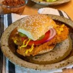 pork tenderloin on a sesame seed bun.