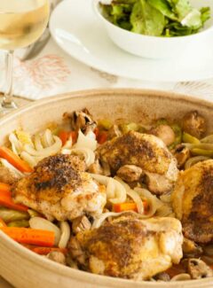 Baked chicken thighs with vegetables. Super easy recipe for a busy family and the flavor is outstanding! | joeshealthymeals.com