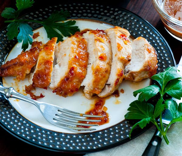 Chicken breast with spicy apricot glaze on a plate.