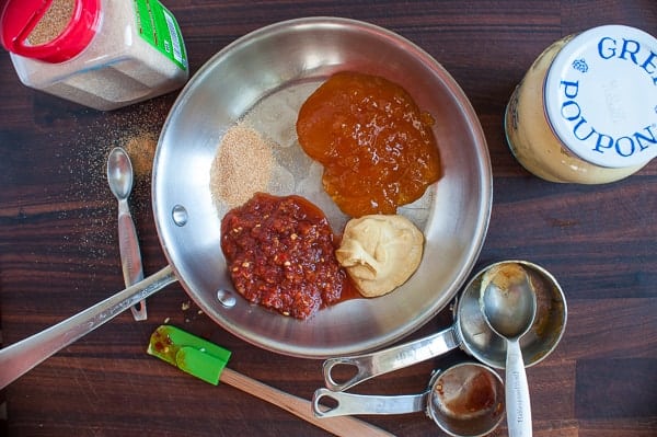 Ingredients for the chili apricot glaze in a small skillet.