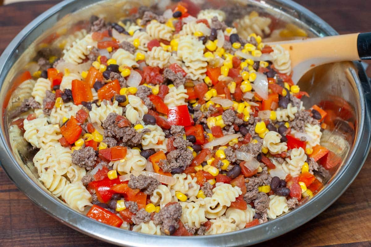 Mixing bowl with ground beef ingredients.