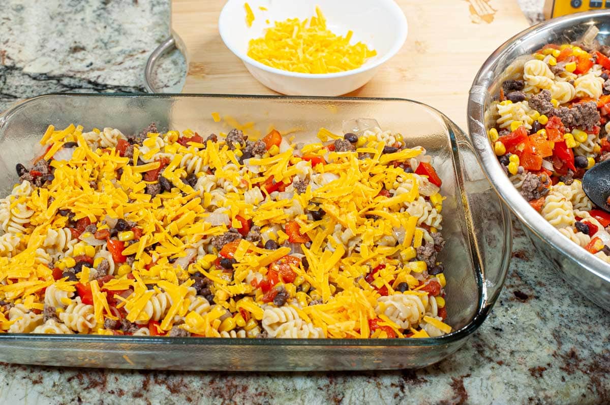 Assembling the Mexican casserole dish.