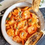 Vodka sauce on penne pasta with shrimp.