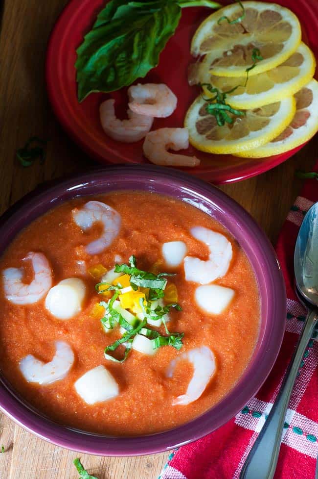 Bowl of gazpacho with precooked shrimp.