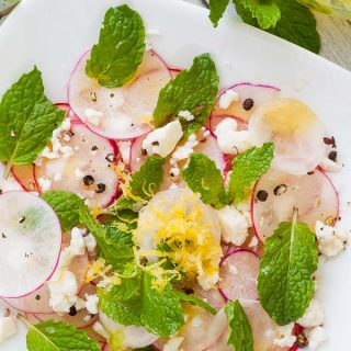 Shaved radish salad on a white plate. | joeshealthymeals.com
