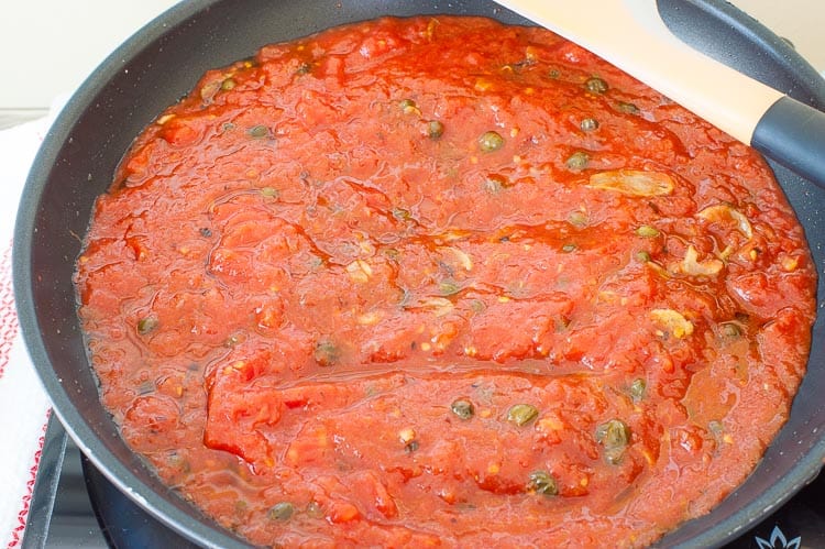 Tomatoes are added to make the sauce right in the skillet.