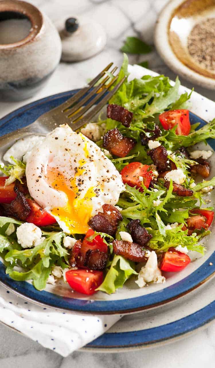 Curly endive lettuce salad with bacon and poached egg. | joeshealthymeals.com