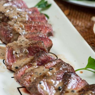 Filet mignon with peppercorn sauce is a luxury treat...perfect for a date night, stay home meal. | joeshealthymeals.com