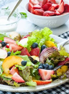 Fresh garden greens salad with fruit and yogurt dressing. | joeshealthymeals.com