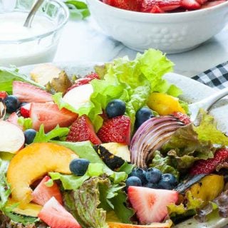 Fresh garden greens salad with fruit and yogurt dressing. | joeshealthymeals.com