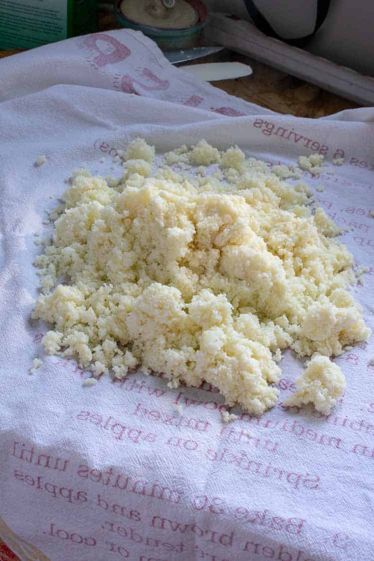 Cauliflower rice on a kitchen towel.
