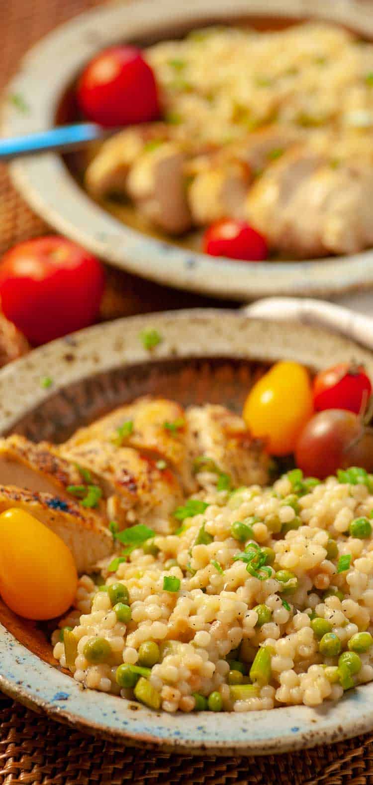 2 bowls of couscous with grilled chicken.