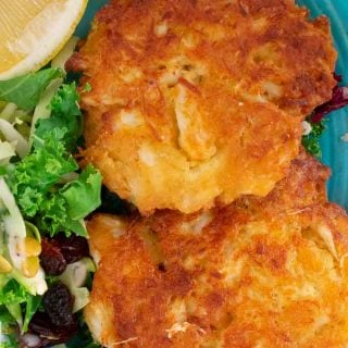 How to make crab cakes with canned crab meat. Simple ingredients are used to bring out the most crab flavor. #crabcakes #seafood #crabfritters #maincourse