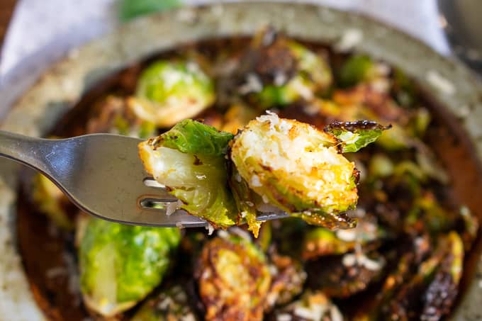 Fork with a roasted Brussels sprout.