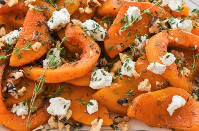 Platter of roasted squash with goat cheese.