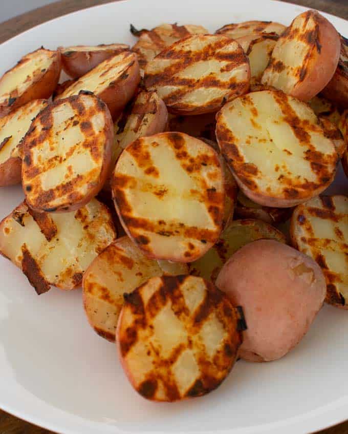 Grilled baby potatoes showing nice grill marks.