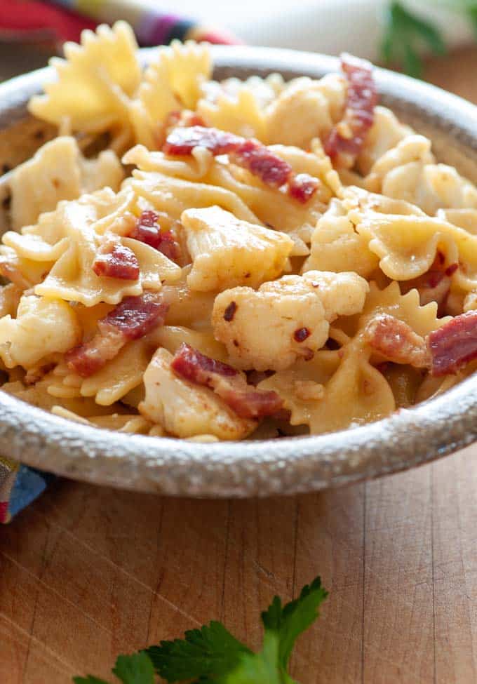 Bowl of pasta with cauliflower and pancetta.