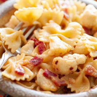 Close-up view of bowl of pasta with cauliflower and pancetta.