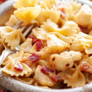 Close-up view of bowl of pasta with cauliflower and pancetta.