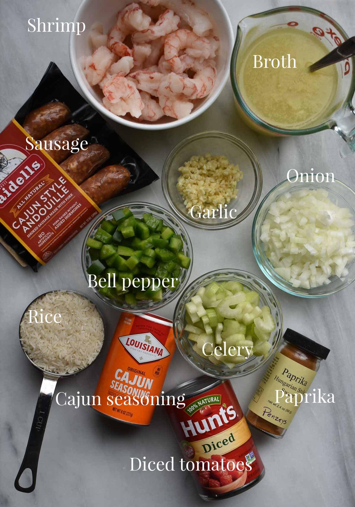 Labeled ingredients for sausage and shrimp jambalaya.