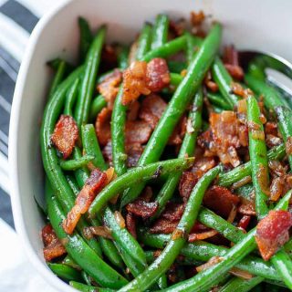 green beans with bacon and onions in a serving dish