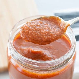 Spoonful of enchilada sauce.