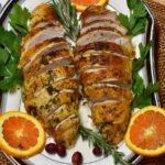 Sliced turkey breast on a serving platter ready to eat.