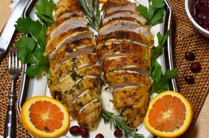 Sliced turkey breast on a serving platter ready to eat.