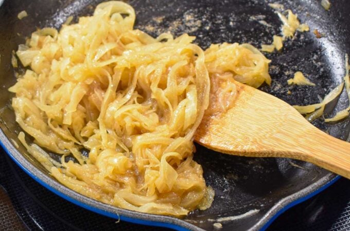 Caramelized onions in a cast iron skillet.